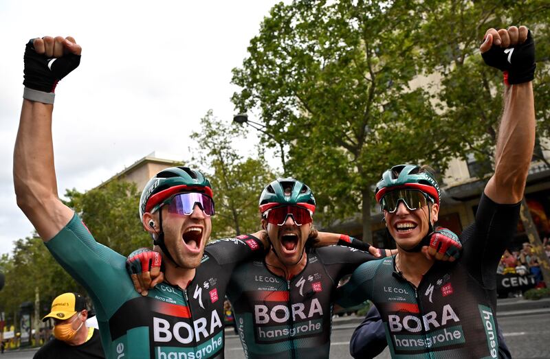 Bora-Hansgrohe rider Jordi Meeus, left, celebrates with teammates. EPA