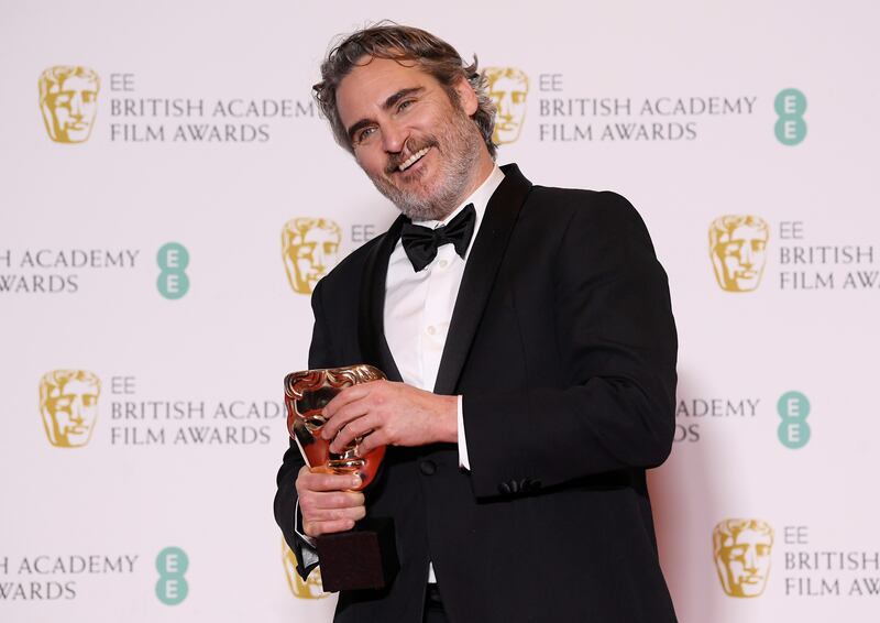 Joaquin Phoenix poses with his award for Leading Actor for 'Joker' at the British Academy of Film and Television Awards (BAFTA) at the Royal Albert Hall in London, Britain, February 2, 2020. REUTERS/Toby Melville     TPX IMAGES OF THE DAY