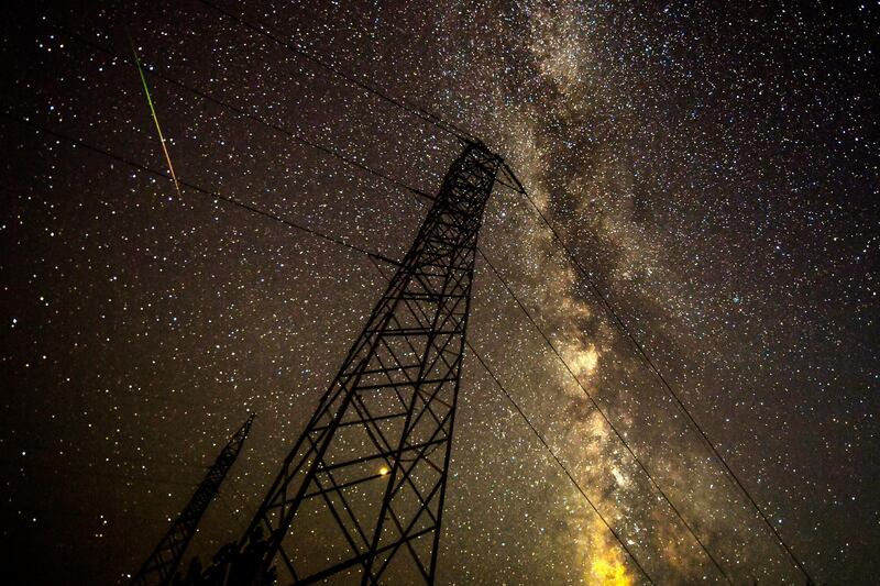 Meteors streaks through the night sky during the Perseid meteor shower over the lake of Kozjak, some 45km from the capitol Skopje, Macedonia. EPA