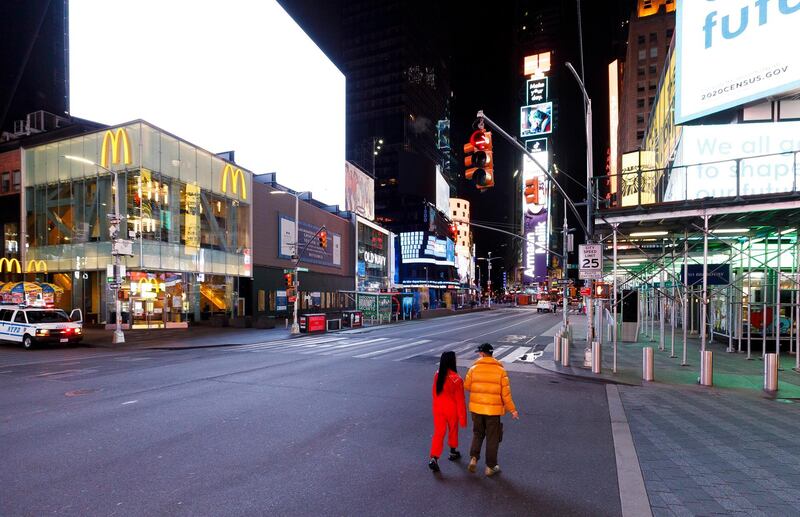People walk through a nearly empty Times Square in New York, USA.  EPA