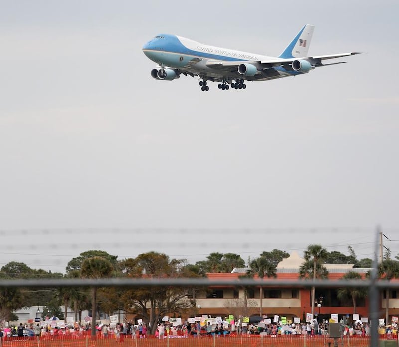 Air Force One with US President Donald Trump on board arrives for a rally in Florida, where Trump claimed he had secured a reduction in the cost of a new jet. Gregg Newton / AFP


