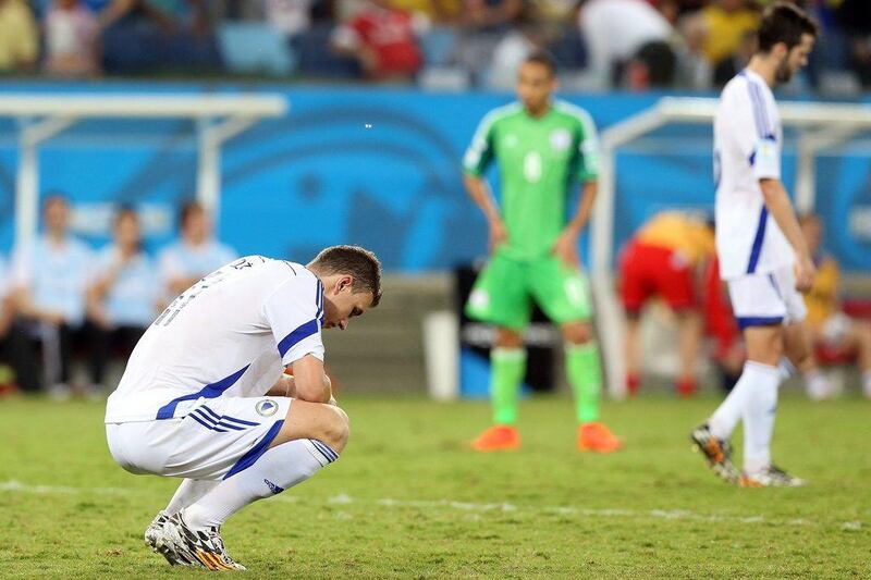 Edin Dzeko of Bosnia and Herzegovina reacts after his side's 1-0 loss to Nigeria on Saturday at the 2014 World Cup in Cuiaba, Brazil. Jose Coelho / EPA / June 21, 2014 