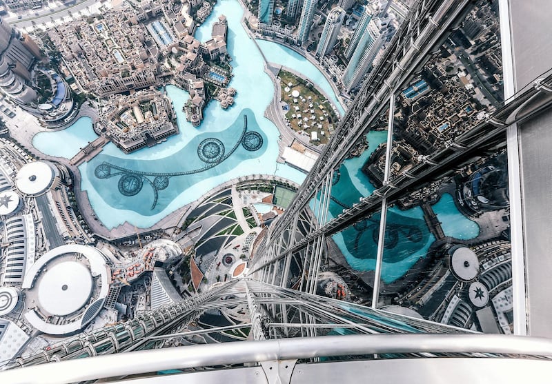 The Dubai Fountain and exterior of Burj Khalifa are seen from the 124th floor of the Burj Khalifa on February 8, 2017 in Dubai, United Arab Emirates. Photo by Jumana Jolie for Getty Images