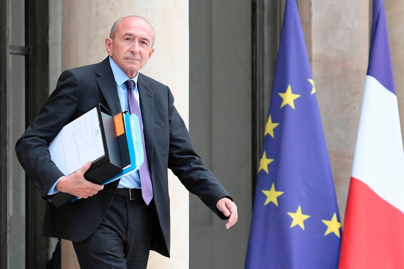 French Interior Minister Gerard Collomb leaves the Elysee Palace, in Paris, following a cabinet meeting, on August 2, 2017. / AFP PHOTO / STEPHANE DE SAKUTIN