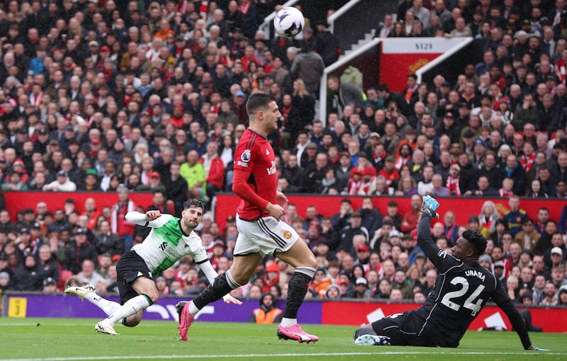 Manchester United's goalkeeper Andre Onana makes a save from Liverpool's Dominik Szoboszlai. EPA