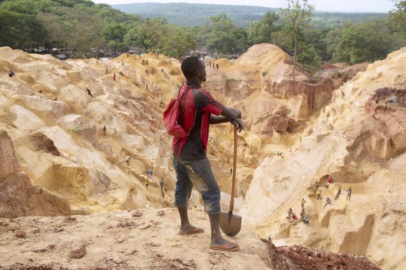 A prospector takes a break at the open pit at Ndassima gold mine near Djoubissi. Siegfried Modola / Reuters