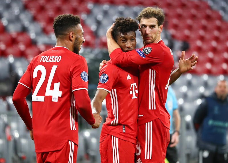 Bayern Munich's Kingsley Coman, centre, is congratulated by teammates after scoring his team's fourth goal. AP