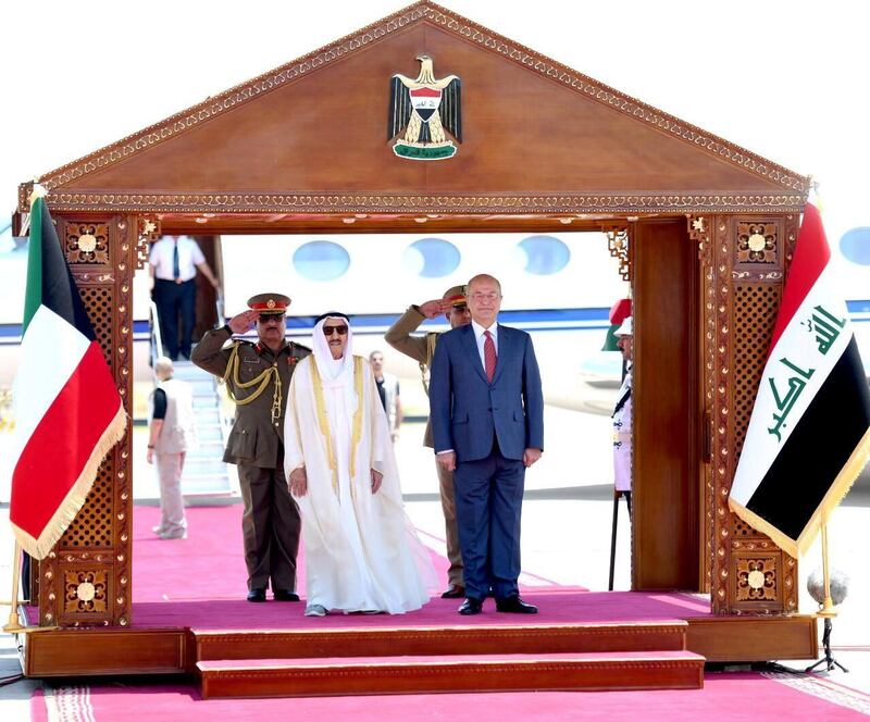 Iraq's President Barham Salih stands with Kuwait's emir Sheikh Sabah Al Ahmad Al Sabah during a welcoming ceremony in Baghdad. The Presidency of the Republic of Iraq Office / Handout via Reuters