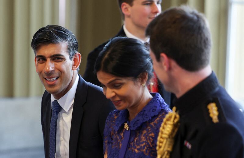 British Prime Minister Rishi Sunak and his wife Akshata Murty arrive at the event. Reuters