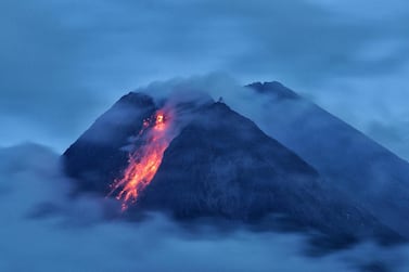 Mount Merapi volcano spews hot lava as it erupts, as seen from Wonorejo in Sleman, Yogyakarta, Indonesia on January 18, 2021. Antara Foto / Reuters 