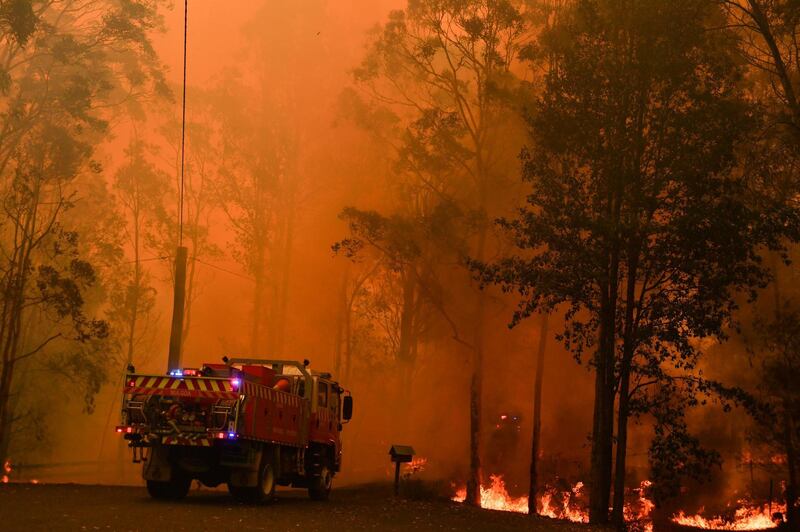 Fire trucks are seen during a bushfire in Werombi, 50km southwest of Sydney, Australia.  Reuters