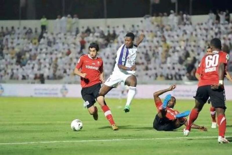 Asamoah Gyan, centre, is on a one-year loan at Al Ain from parent club Sunderland. Anas Kanni / Al Ittihad