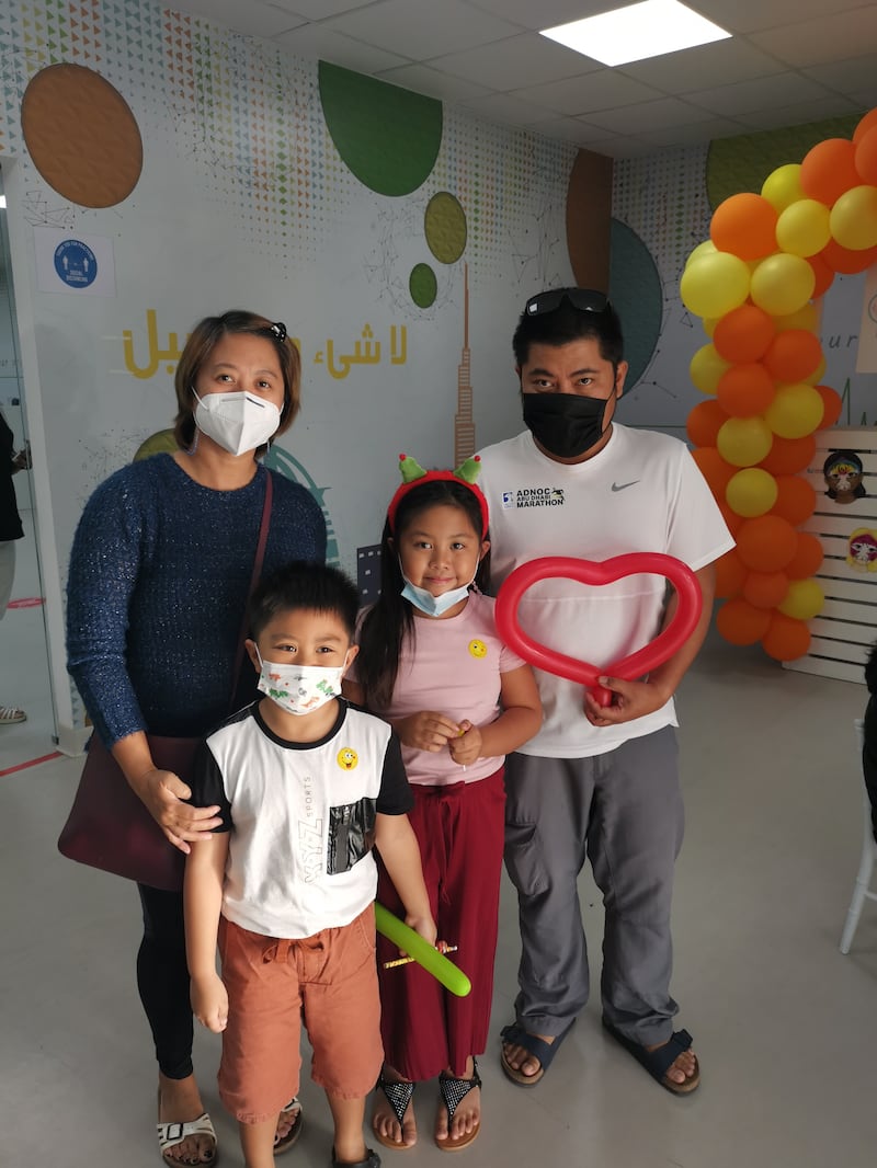 Len Apie, from the Philippines, brought her children Lewis, 9, and Clark, 6, to receive a dose of the Pfizer-BioNTech Covid-19 vaccine in Dubai. All photos: Shuchita Gautam