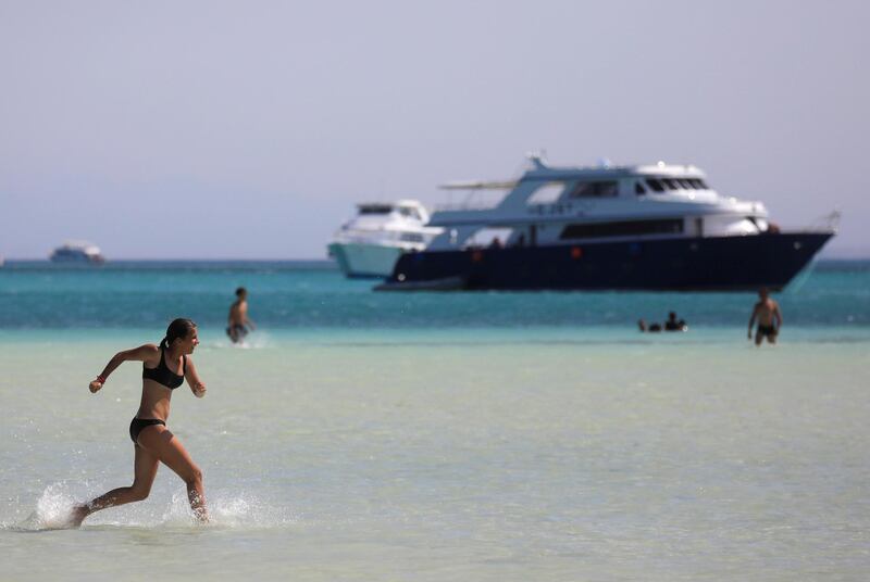 A tourist enjoys during a summer vacation on the Orange beach at a Red Sea resort, amid the coronavirus disease (COVID-19) pandemic, in Hurghada, Egypt August 25, 2020. REUTERS/Amr Abdallah Dalsh