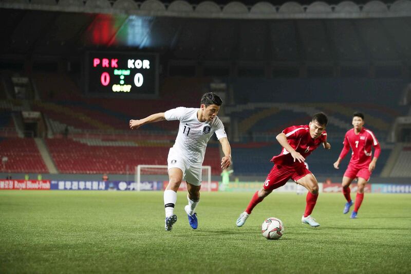 North Korea take on South Korea in a World Cup 2022 qualifier at Kim Il Sung Stadium, Pyongyang, on Tuesday, October 15. The match was played out in a virtually empty stadium with no fans from either side present. Reuters