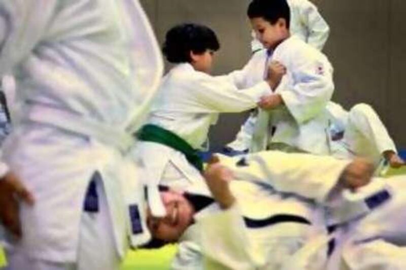 Abu Dhabi, United Arab Emitrates --- July 4, 2010 --- Kids make their moves during a judo summer camp in Abu Dhabi on Sunday, July 4, 2010.  ( Delores Johnson / The National )