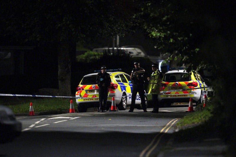 Emergency services close off a road near the scene of the mass shooting in Plymouth, England.