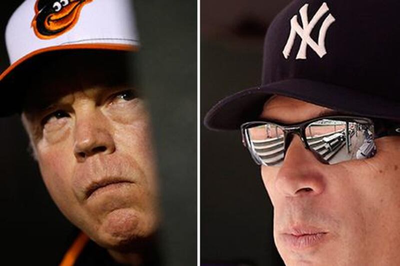 Buck Showalter, left, a former New York Yankees manager now managing the Baltimore Orioles, was quick to compliment his former organisation's ability to steal signs a day after the current Yankees manager, Joe Girardi, accused Showalter's Orioles of doing just that in a heated argument. AP Photos