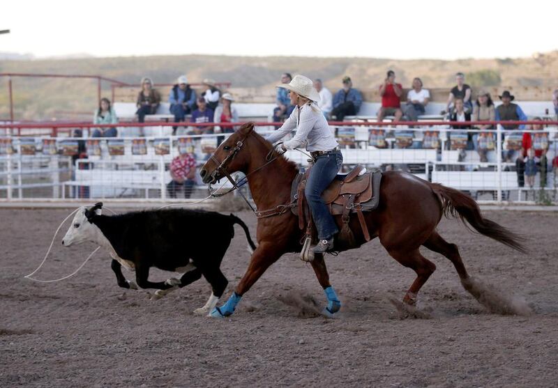 Jessie Springer tosses a lasso around a calf at the rodeo in Truth or Consequences, New Mexico. Many agree that Spaceport America should inject new energy into the town. Lucy Nicholson / Reuters