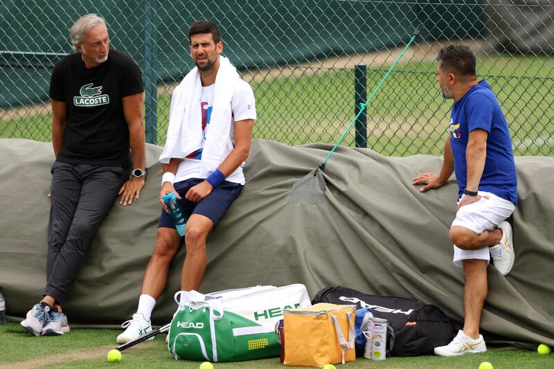 Novak Djokovic, a 20-time Grand Slam winner, takes a break from training at Wimbledon. Getty