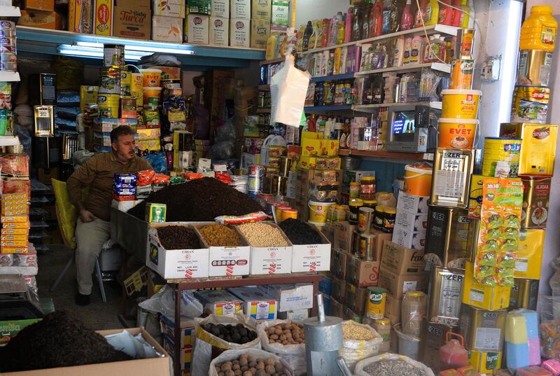 An Iraqi salesman at a shop at the "Al Bursa" wholesale market in the northern city of Mosul, November 28. AFP