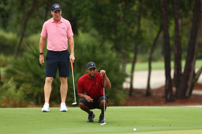 Tiger Woods and former NFL star Peyton Manning read a putt on the sixth green during The Match: Champions for Charity at Medalist Golf Club in Hobe Sound, Florida, USA.  EPA