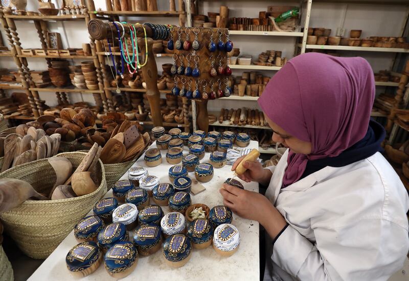 A Tunisian craftswoman works in the village, which is a popular tourist destination during Ramadan