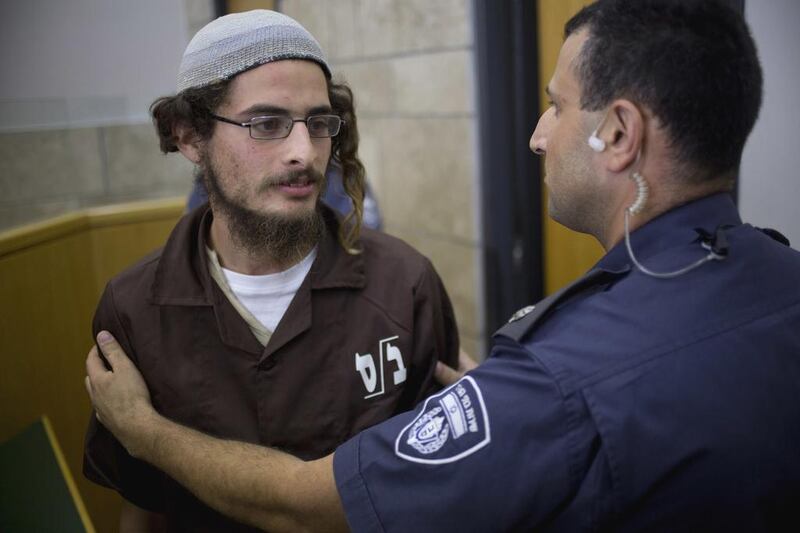 Meir Ettinger appears in court in Nazareth Illit last August. Ariel Schalit, File/AP Photo