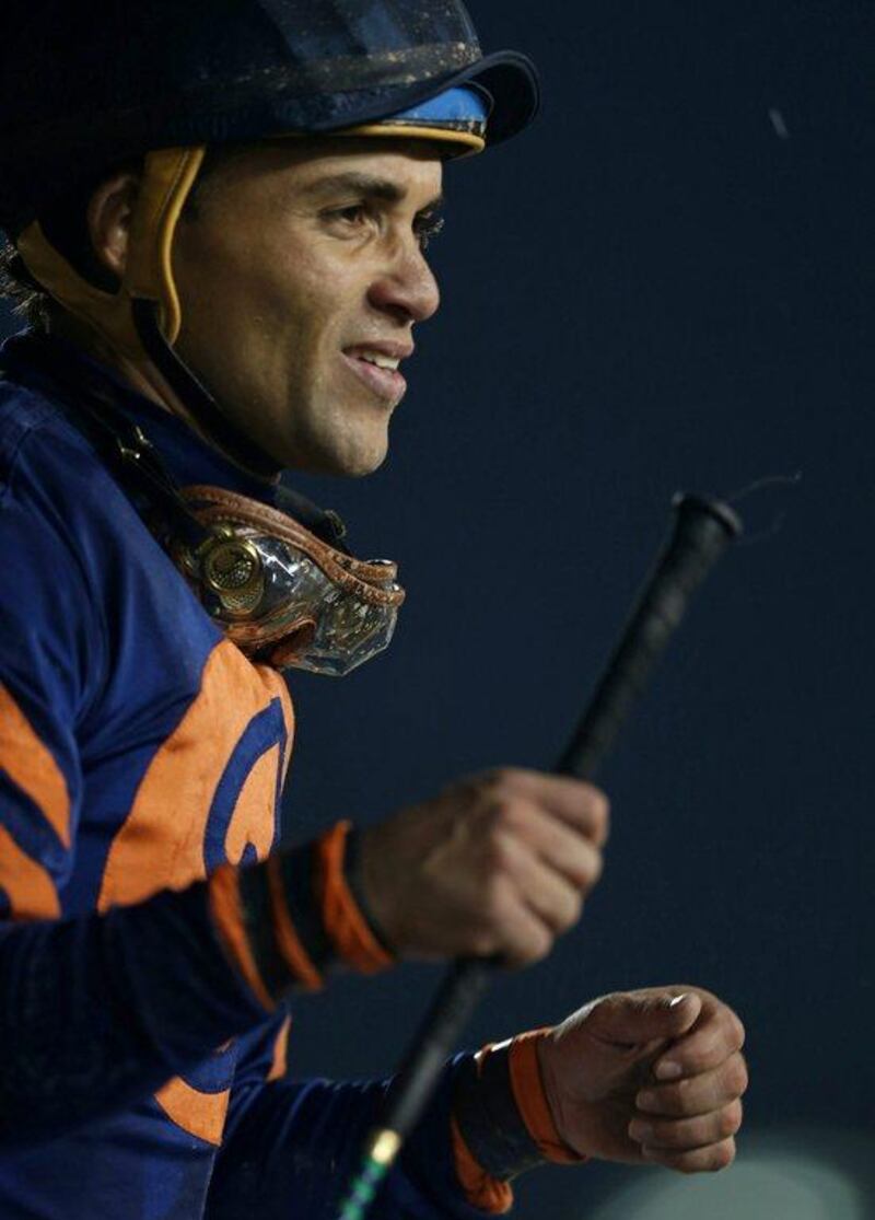 Joel Rosario rides Mind Your Biscuits as he celebrates winning the sixth race. Reuters stringer