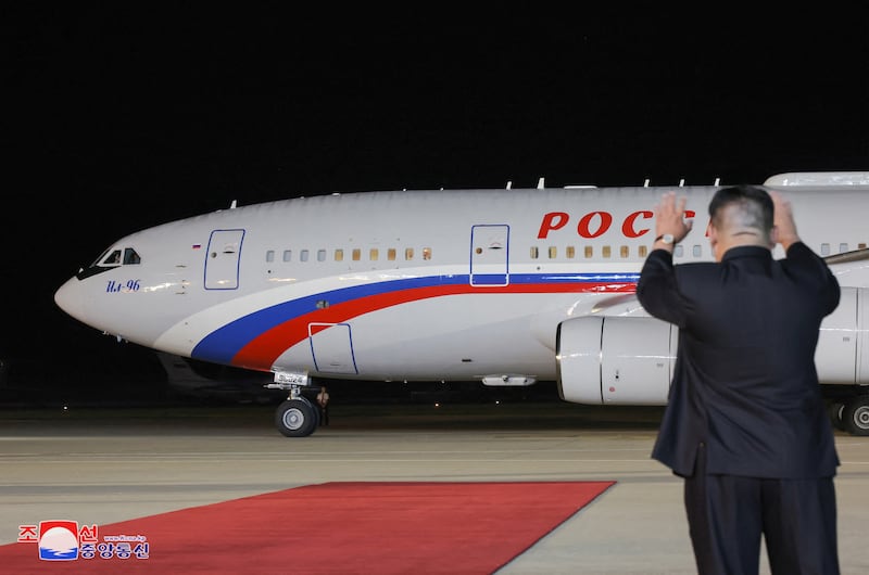 North Korean leader Kim Jong-un waves at Russian President Vladimir Putin's plane as it leaves Pyongyang. Reuters
