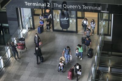 LONDON, ENGLAND - AUGUST 22: Travellers exit Heathrow Airport Terminal 2 on August 22, 2020 in London, England. As of Saturday morning at 4am, travellers arriving in England from Austria, Croatia, and Trinidad and Tobago were required to quarantine themselves for 14 days. At the same time, travellers from Portugal were no longer required to quarantine. (Photo by Hollie Adams/Getty Images)