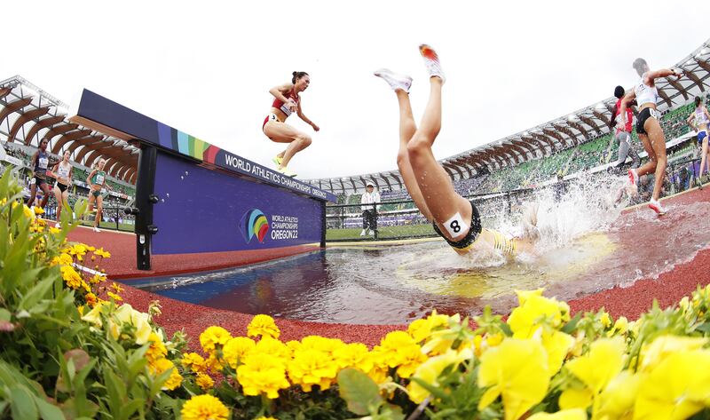 Lea Meyer of Germany falls in the water during the women's 3000m steeplechase heats at the World Athletics Championships at Hayward Field in Eugene, Oregon, on July 16, 2022. EPA