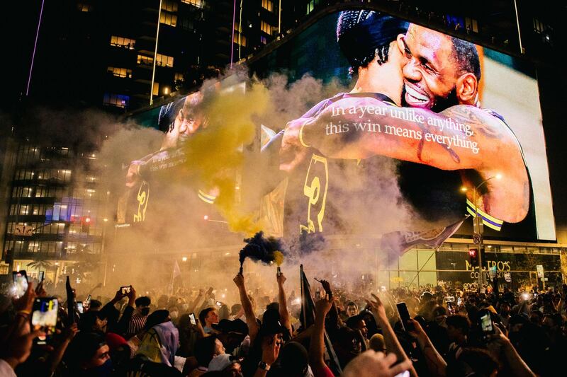 Los Angles Lakers fans celebrate in front of the Staples Center after their team's victory over Miami Heat  in Game 6 to win the NBA Finals on Sunday, October 11. AFP