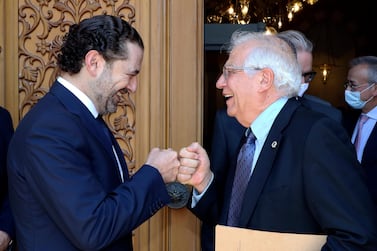 Lebanese Prime Minister-Designate Saad Hariri, left, greets European Union foreign policy chief Josep Borrell with a fist bump, in Beirut, Lebanon, on Saturday. Image: AP