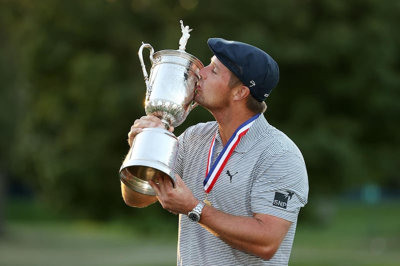 Bryson DeChambeau of the United States kisses the trophy after winning the 2020 US Open at Winged Foot in New York. AFP