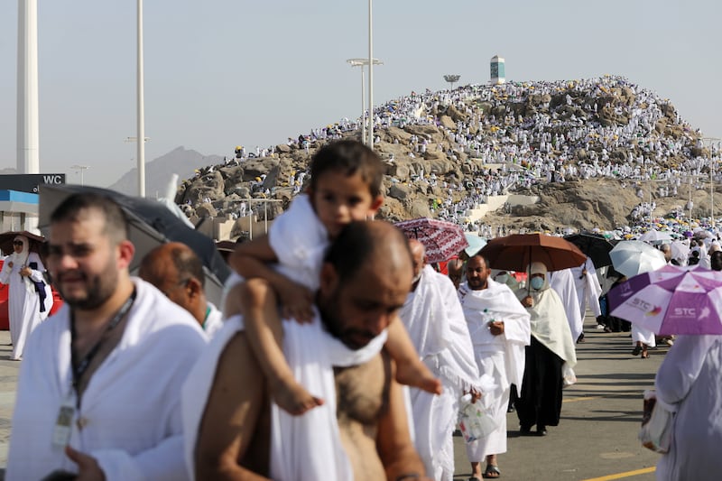 Muslim pilgrims pray on Mount Arafat during Hajj. EPA