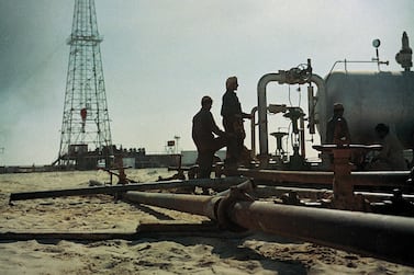 Workers at the Murban 2 well in 1958. Two years later the Murban 3 well would find commercial quantities of crude oil 1956. Rigs general. UAE Coast. Abu Dhabi crew working on Murban 2. Courtesy: Adnoc *** Local Caption *** 1961/12