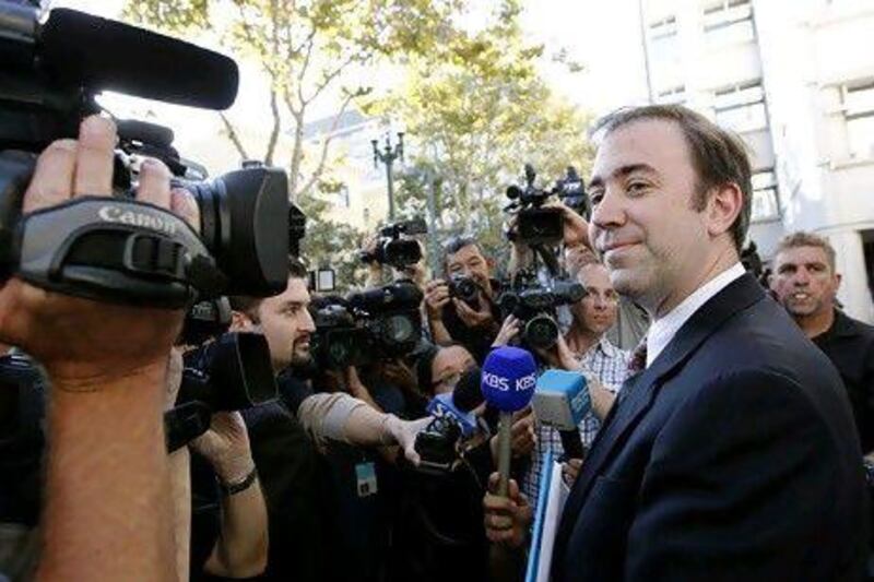 Jason Bartlett, counsel for Apple, speaks with reporters following the jury's decision. Reuters