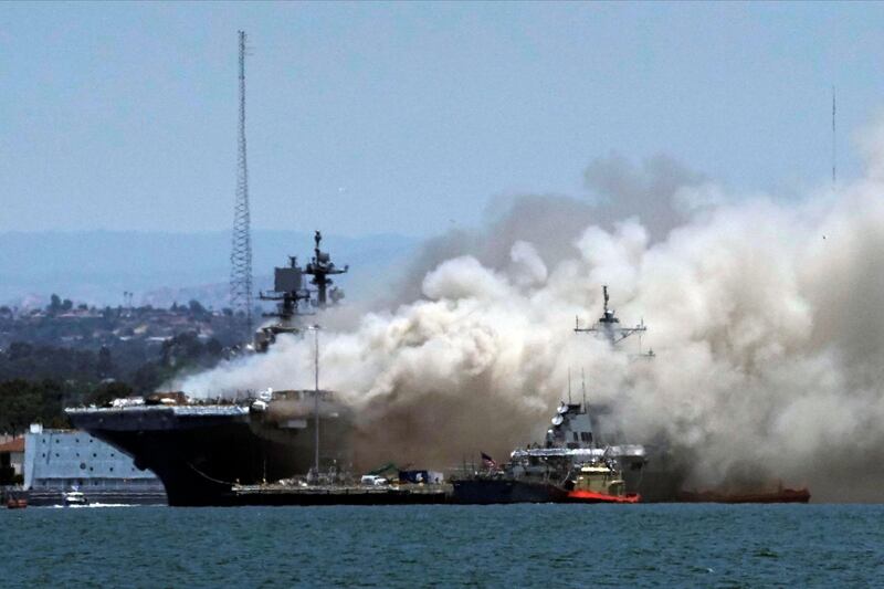 Smoke rises from a fire on board the US Navy ship 'USS Bonhomme Richard' at the naval base in San Diego, as seen from Coronado, California, US. Reuters