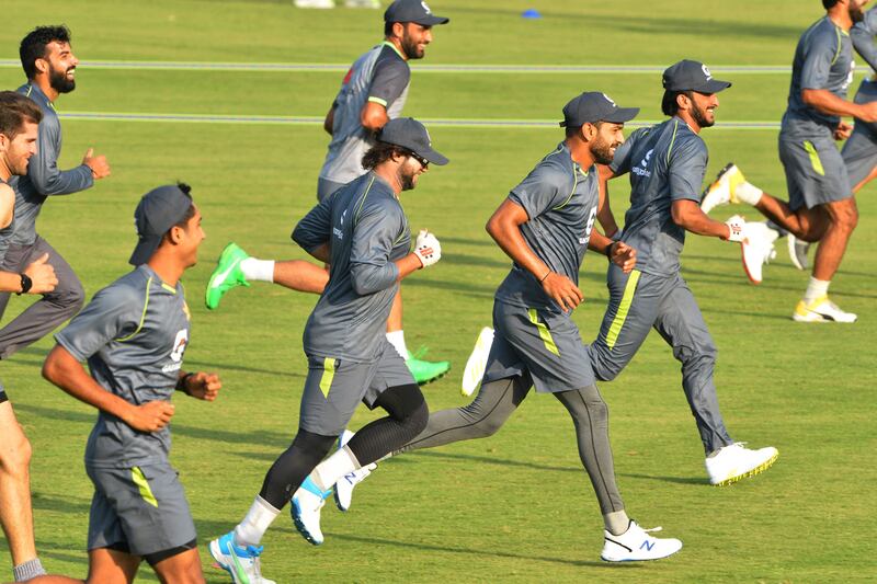 Pakistan cricketers warm up during a practice session at the Rawalpindi Cricket Stadium on September 14, 2021. AFP