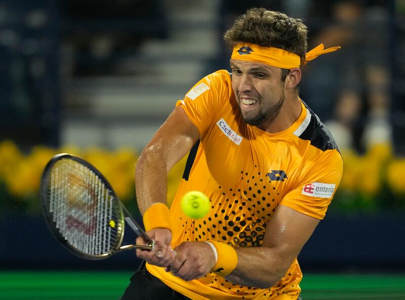 Jiri Vesely returns the ball to Novak Djokovic. AP