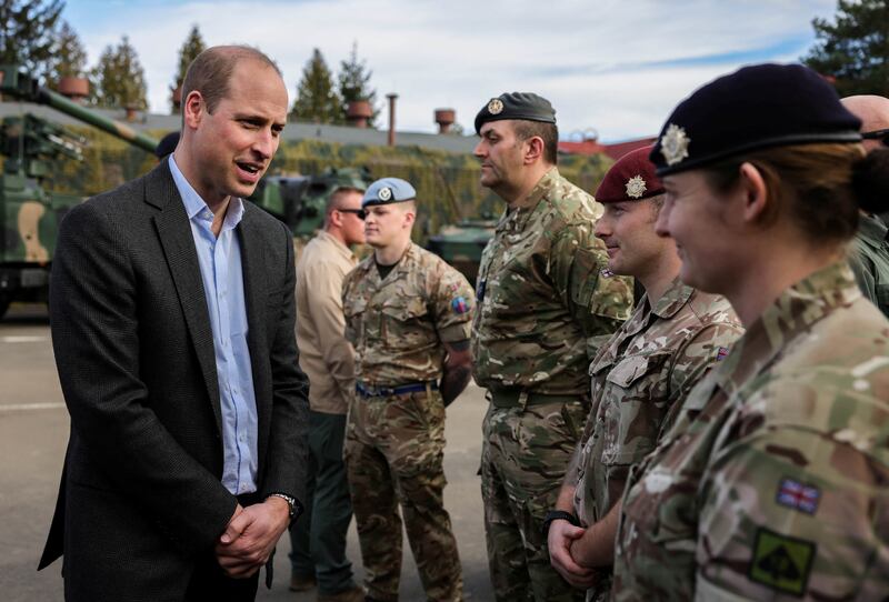 The Prince of Wales speaks with servicemembers at the base, which has been heavily involved in providing support to Ukraine. Reuters