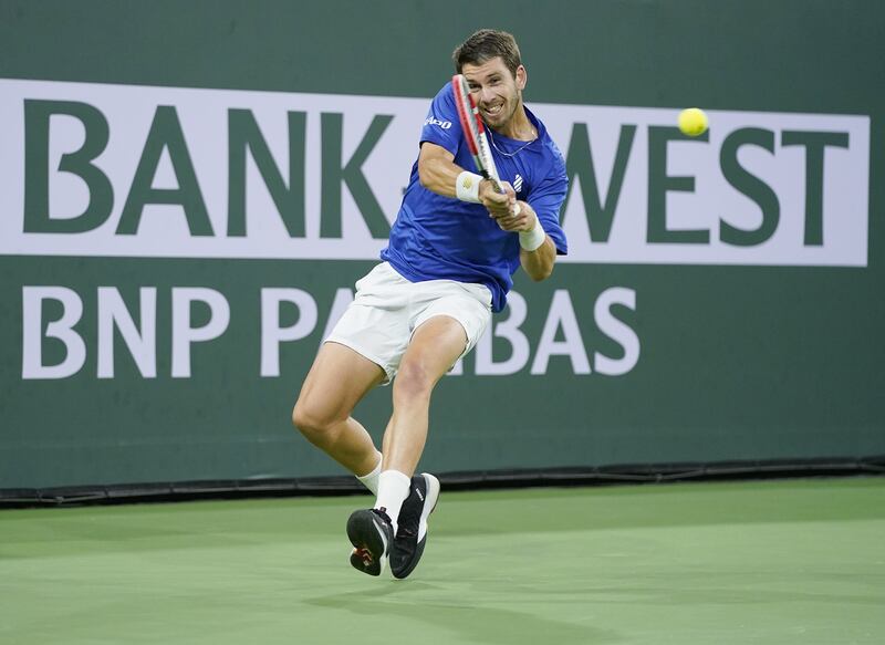 Cameron Norrie of Great Britain hits a return to Nikoloz Basilashvili of Gerogia. EPA