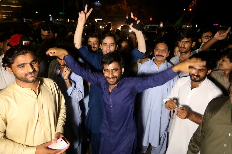 Supporters of an opposition party celebrate in Karachi, after the announcement of the results. AP