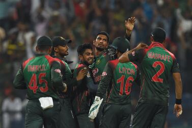 Bangladesh cricketer Mahmudullah, centre, celebrates with his teammates after he dismissed Pakistan batsman Imam-ul-Haq during an Asia Cup match in Abu Dhabi on September 26, 2018. AFP