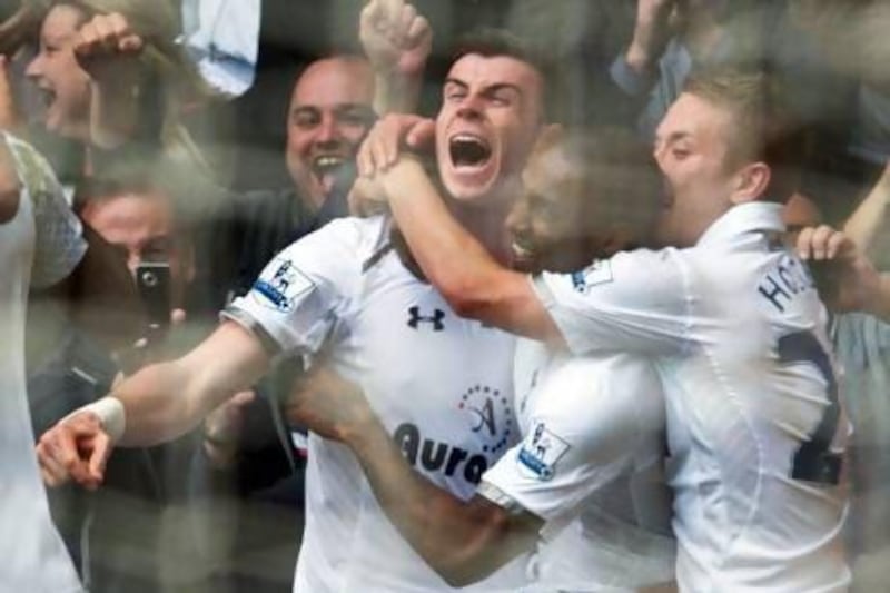 Tottenham Hotspur’s Gareth Bale, left, celebrates his goal with teammates yesterday. Tom Hevezi / EPA