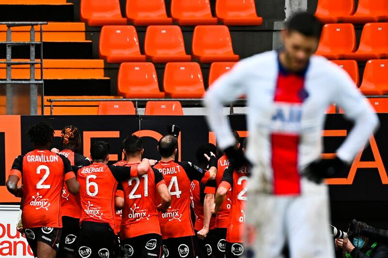 Paris Saint-Germain's Argentinian forward Mauro Icardi reacts as Lorient's players celebrate. AFP