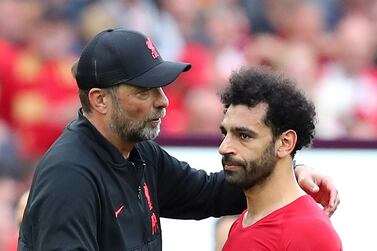 LIVERPOOL, ENGLAND - MAY 22: Jurgen Klopp, Manager of Liverpool interacts and Mohamed Salah of Liverpool look dejected as Manchester City finish the 2021/2022 season as champions following the Premier League match between Liverpool and Wolverhampton Wanderers at Anfield on May 22, 2022 in Liverpool, England. (Photo by Alex Livesey / Getty Images)