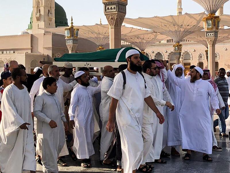 Mourners carry the coffin of the late former Tunisian president Zine El Abidine Ben Ali during his funeral at the Prophet Mohammed's mosque in Saudi Arabia's holy city of Medina, Islam's second holiest city, on September 21, 2019. Ben Ali, who died on September 19 in the Red Sea coastal city of Jeddah, was laid to rest at Al-Baqi cemetery next to the Prophet Mohammed's mosque and a place of great reverence for Muslims. Ben Ali, the first leader to be toppled by the Arab Spring revolts starting in 2011, died aged 83. / AFP / Majed Al Charfi
