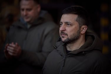 In this photo provided by the Ukrainian Presidential Press Office, Ukrainian President Volodymyr Zelenskyy, looks on as he meets soldiers at the site of the heaviest battles with the Russian invaders in Bakhmut, Ukraine, Tuesday, Dec.  20, 2022.  (Ukrainian Presidential Press Office via AP)